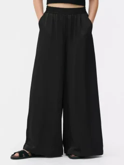 Primark Spodnie I Legginsy<Satynowe spodnie z szeroką nogawką The Edit