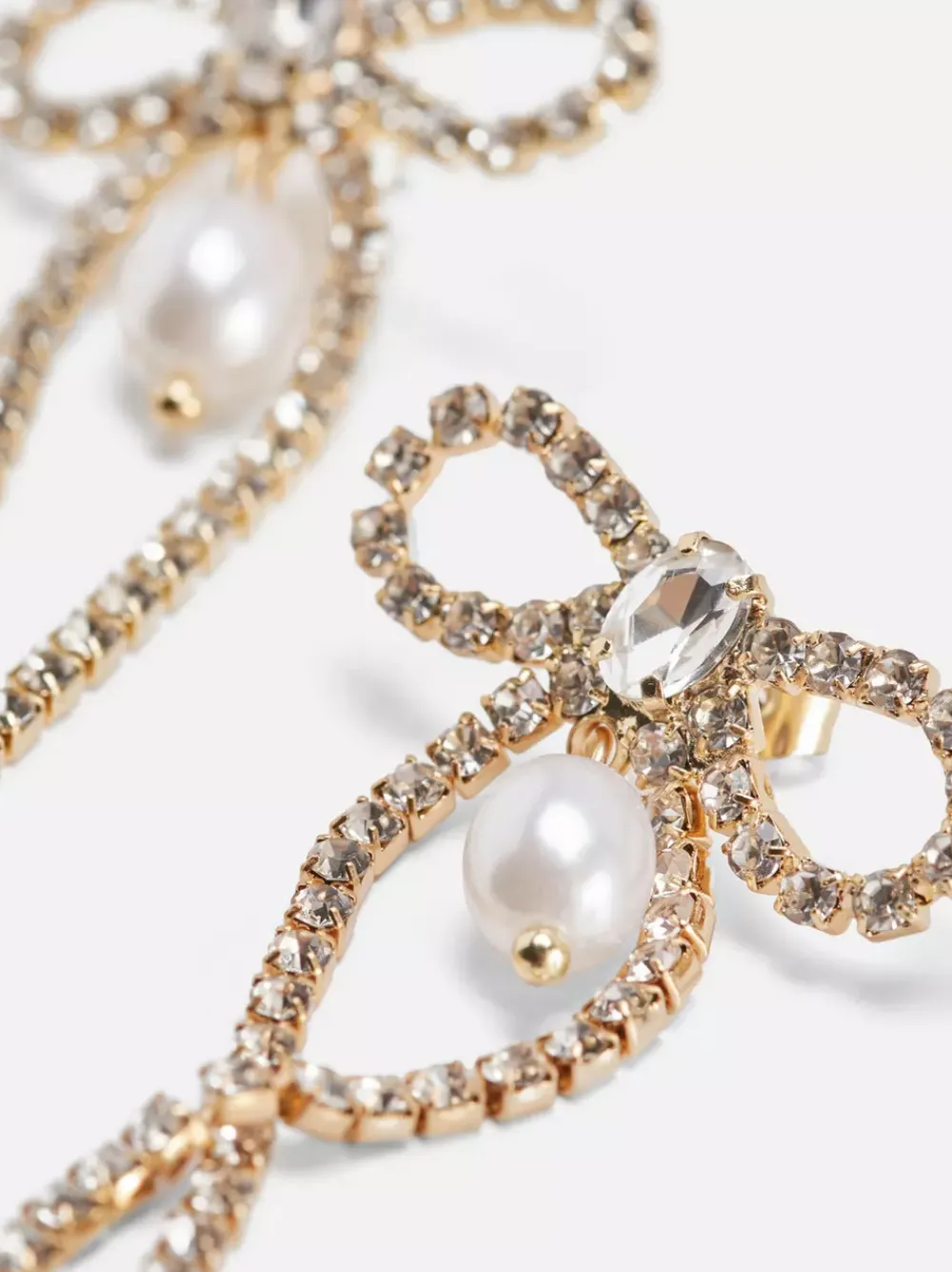 Primark Biżuteria<Wiszące kolczyki w kształcie kokardki z diamencikami